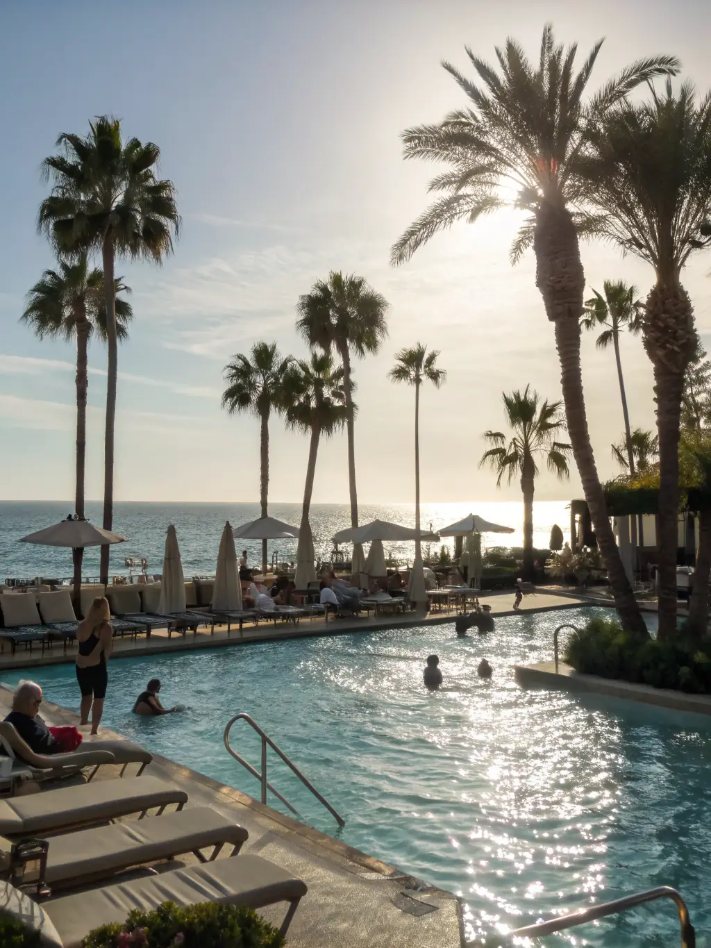 A luxurious swimming pool installed by Paballo Covenant with a beautiful deck and landscaping, creating a personal oasis.